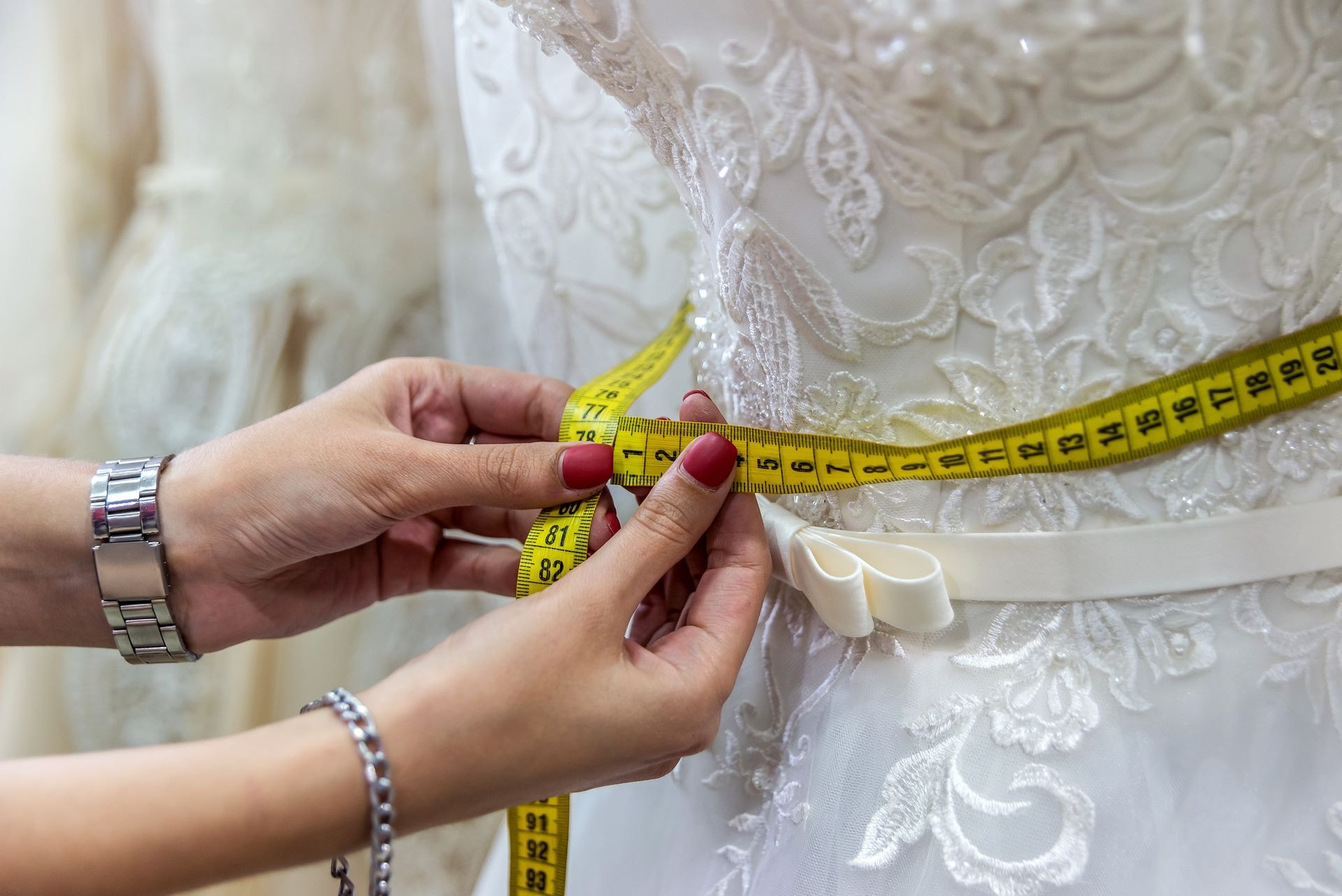 Measuring a wedding dress with a tape measure