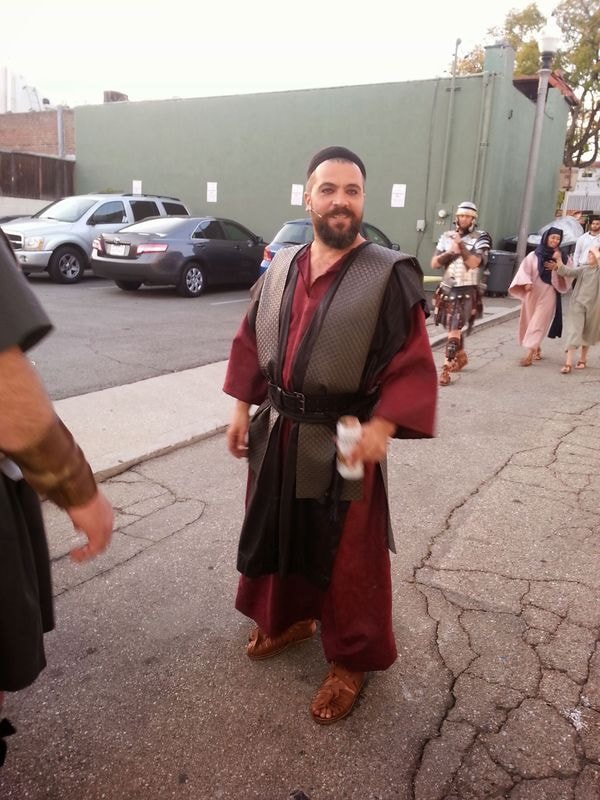 Man in medieval costume at parking lot event